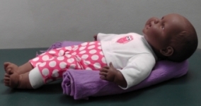 Doll head support with roll.JPG