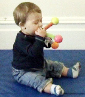 Infant-inspects-toys-many-differnt-ways.jpg