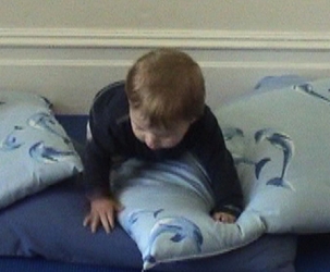 W 9m crawling over pillows 5.jpg