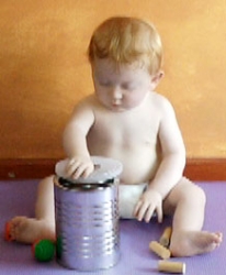 Putting lid on tin 1.jpg